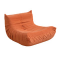 Fauteuil compressé en velours terracotta NOMA